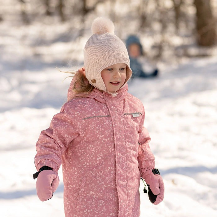 JAN & JUL kids pom-pom knit hat in light pink with fluffy pom-pom for baby and toddler winter wear.