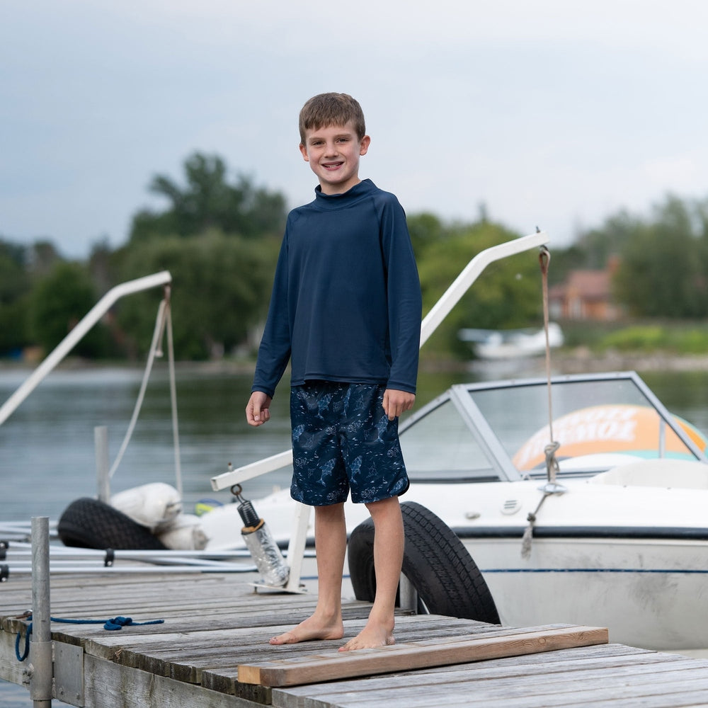JAN & JUL Jan & Jul Kids UV Swim Shorts Navy Whale Play paired with long sleeve mock neck rash guard top img 2/6