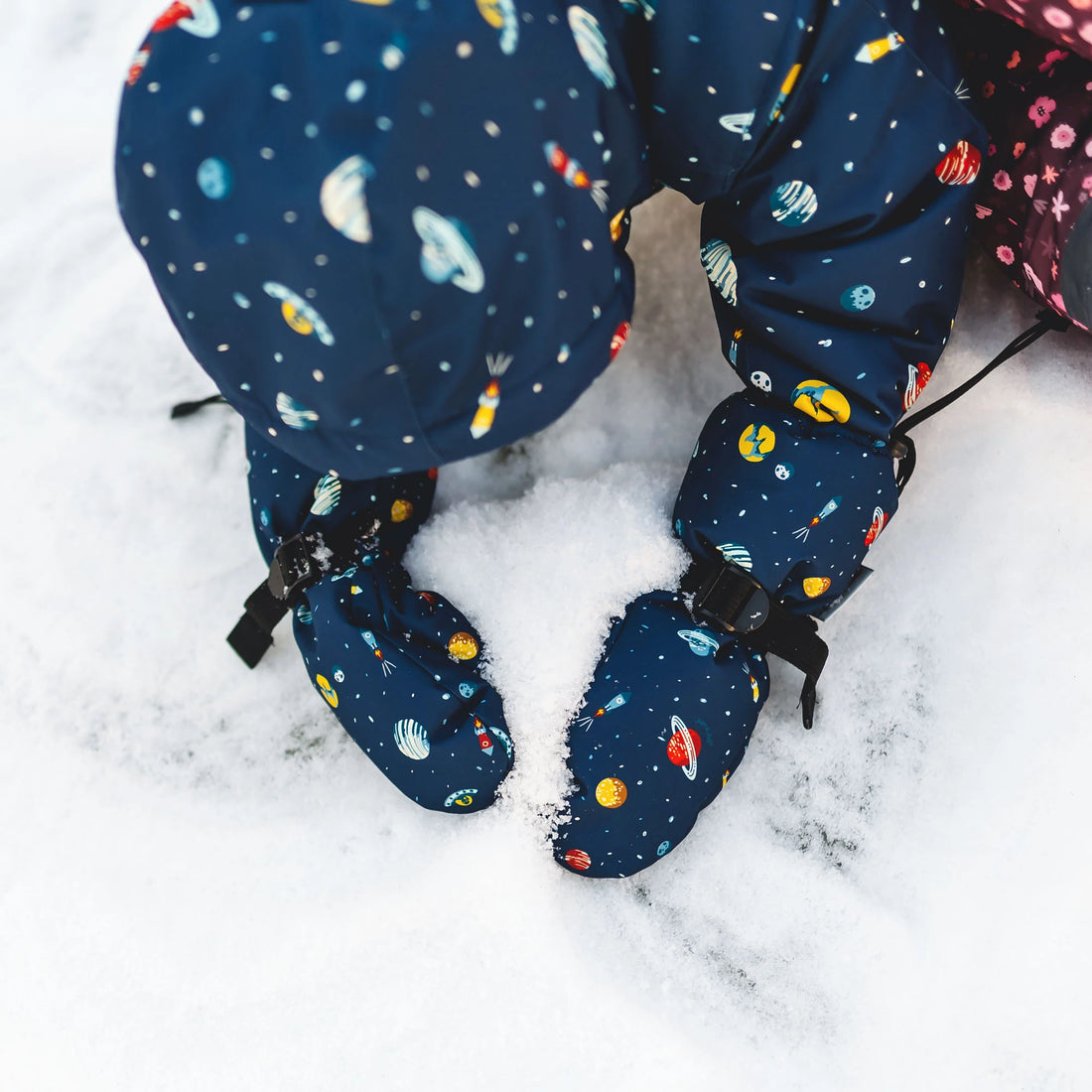 Close-up of Jan & Jul Planet Patrol Mittens during winter play.