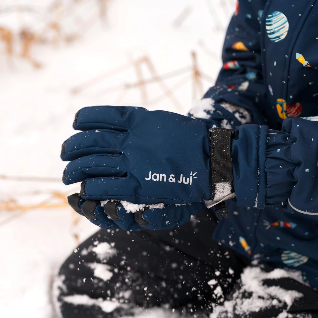 Close-up of Jan & Jul Dark Navy Snow Gloves during winter play.