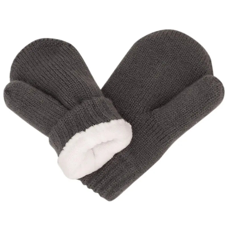 JAN & JUL Knit Mitten Dark Grey with white fleece cuff, two baby mittens laid flat.