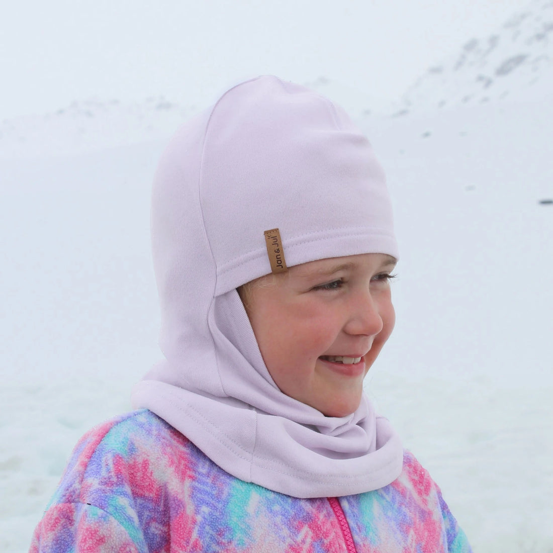 Jan & Jul Kids Thermal Balaclava Lilac — thermal balaclava worn outdoors with winter clothing