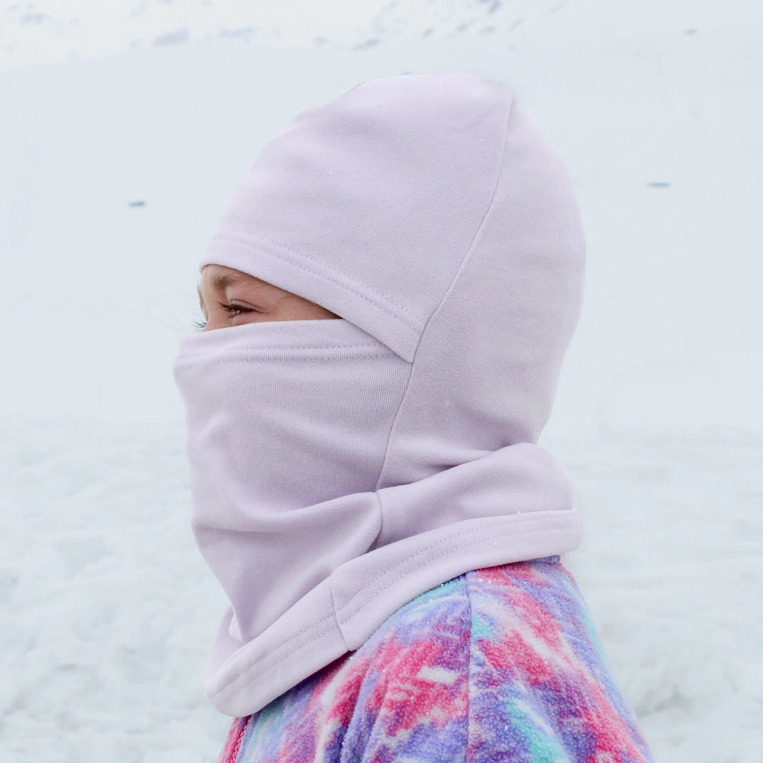 Jan & Jul Kids Thermal Balaclava Lilac — side view of the thermal balaclava worn outdoors