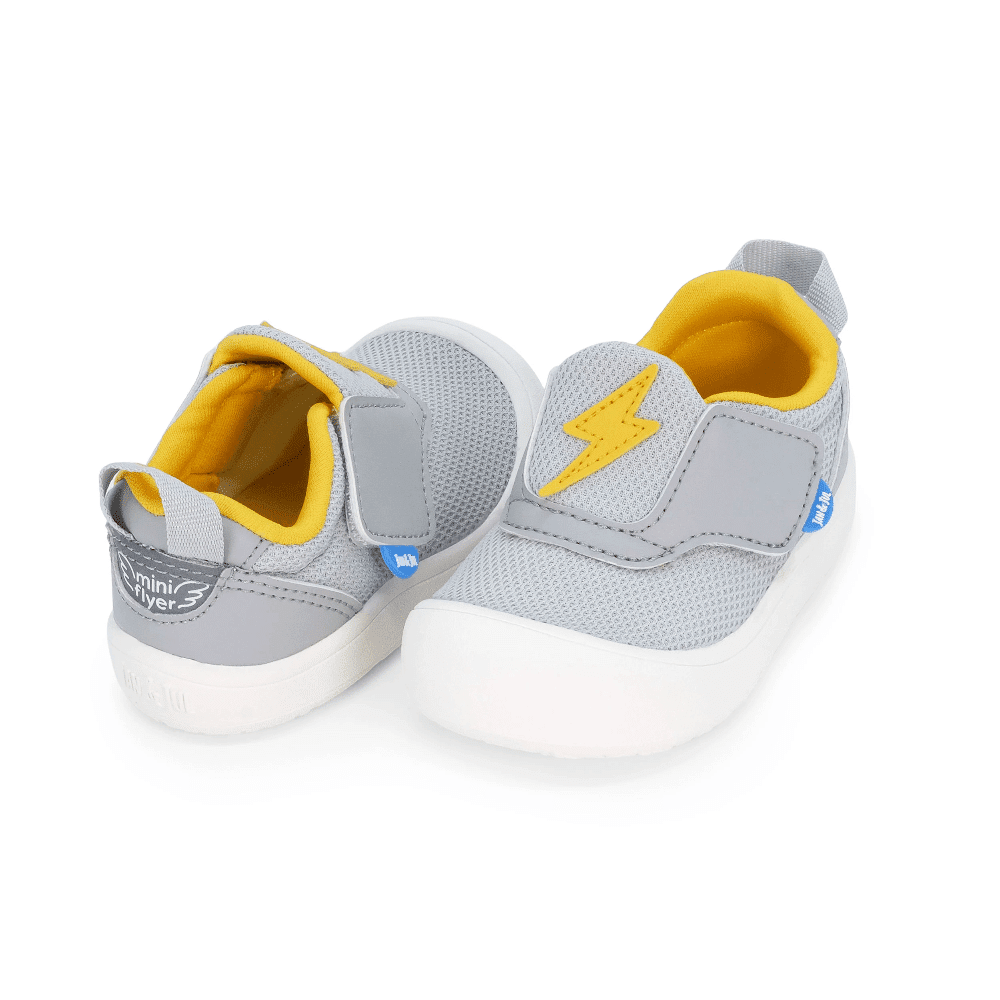 JAN & JUL Mini-Flyer Toddler Sneakers Lightning Bolt, grey mesh with yellow lining, Velcro strap fastened.