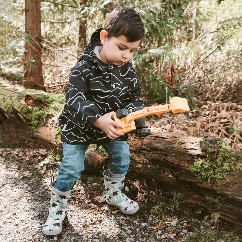 Jan & Jul Puddle Dry Rain Boots Bear for toddlers in gray with bear prints; child outdoors on a log wearing them.