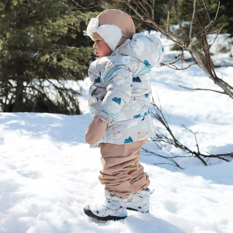 Jan & Jul Toasty Dry Booties Polar Pals in white with blue polar pattern, keeping baby's feet warm as they walk in snow.