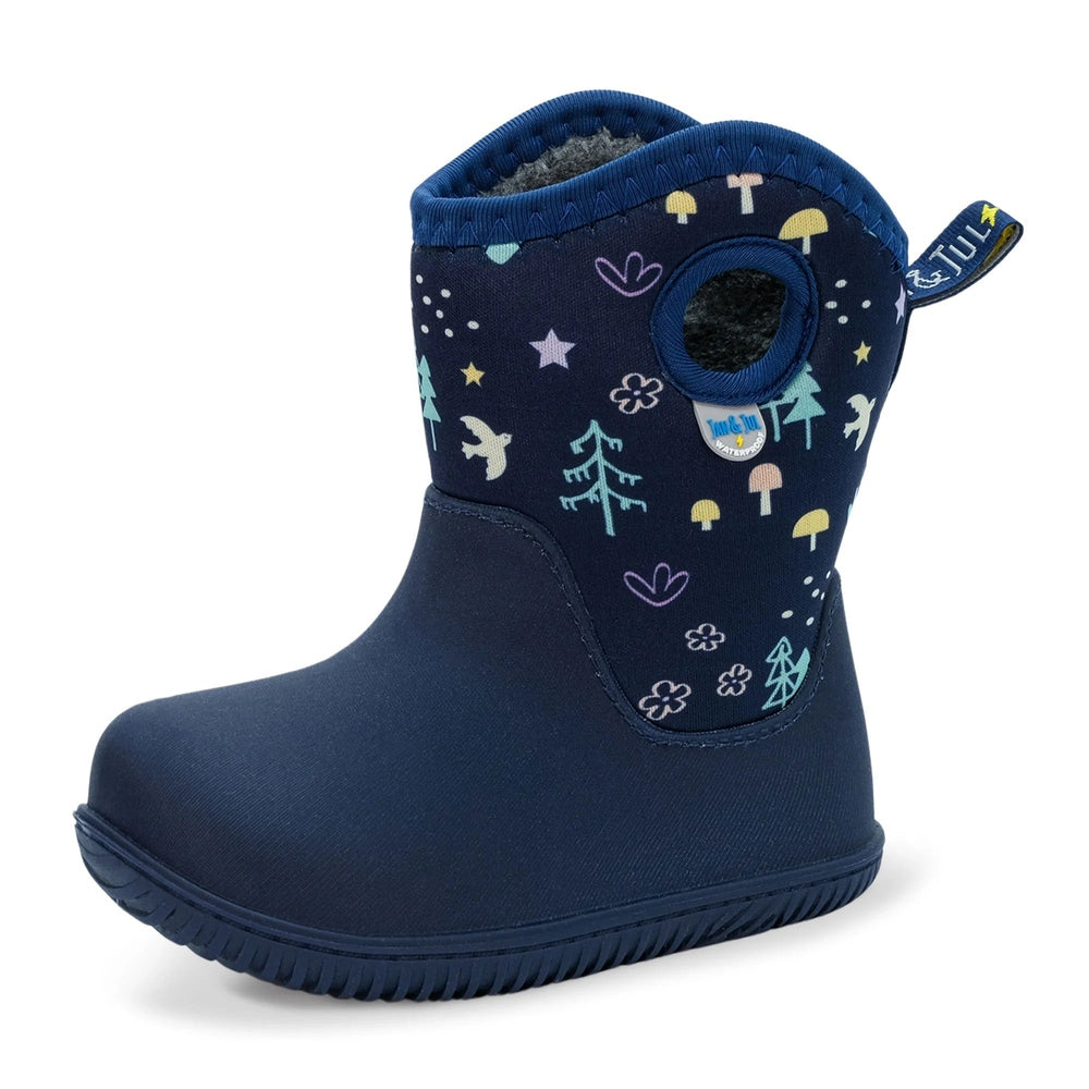JAN & JUL Toasty Dry Lite Winter Boots Navy Forest; toddler stands in navy forest-print boots.
