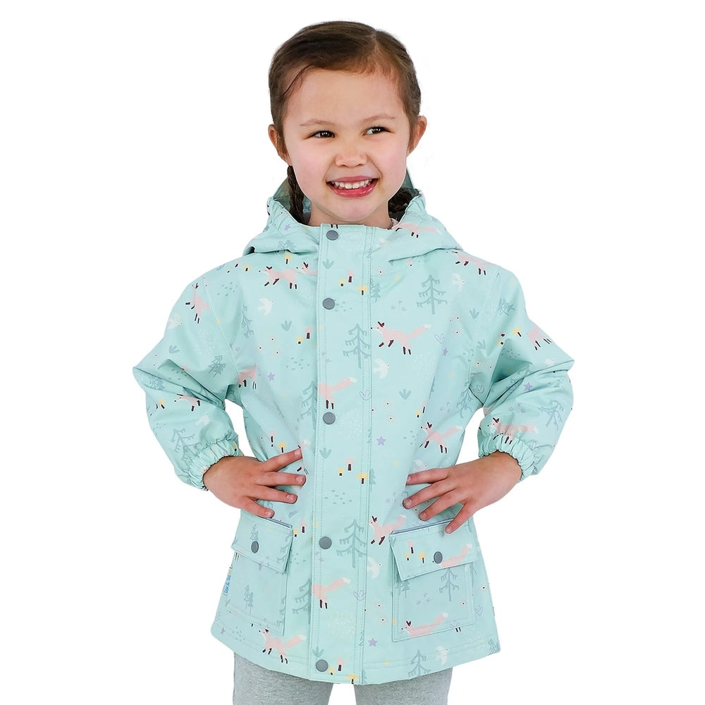 JAN & JUL Waterproof Cozy Dry Rain Jacket Minty Forest worn by a smiling child with hood and front pockets.