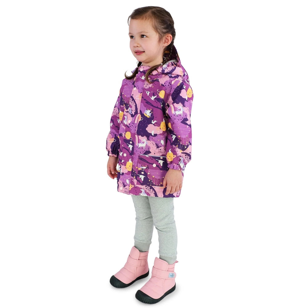 JAN & JUL Waterproof Cozy Dry Rain Jacket Purple Dream worn by a girl in pink boots, hooded for rain