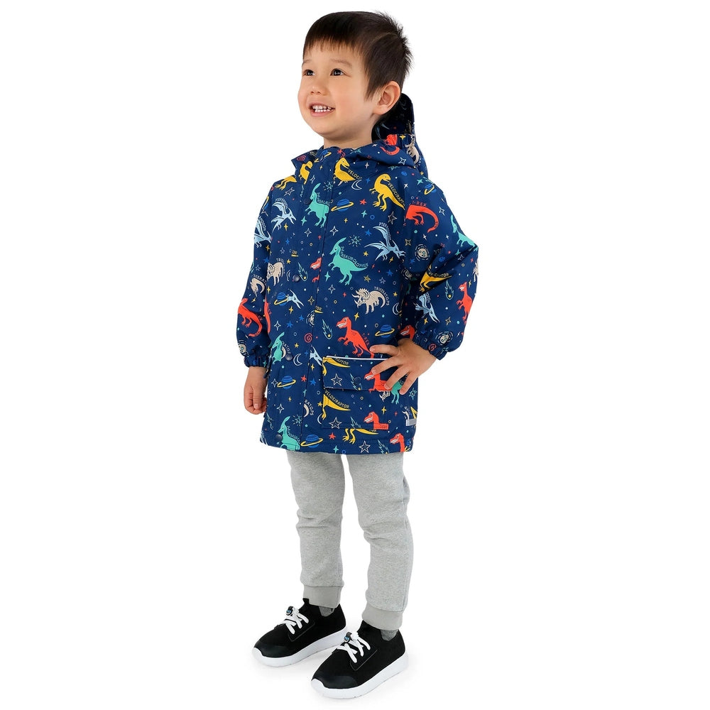 JAN & JUL waterproof Cozy Dry Rain Jacket Space Dinos for kids, blue dinosaur print, hood up with front pocket visible.