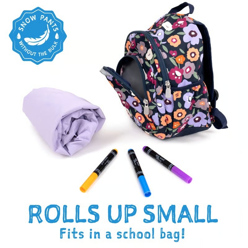 JAN & JUL waterproof cozy dry rain pants pink forest rolled up beside a floral backpack
