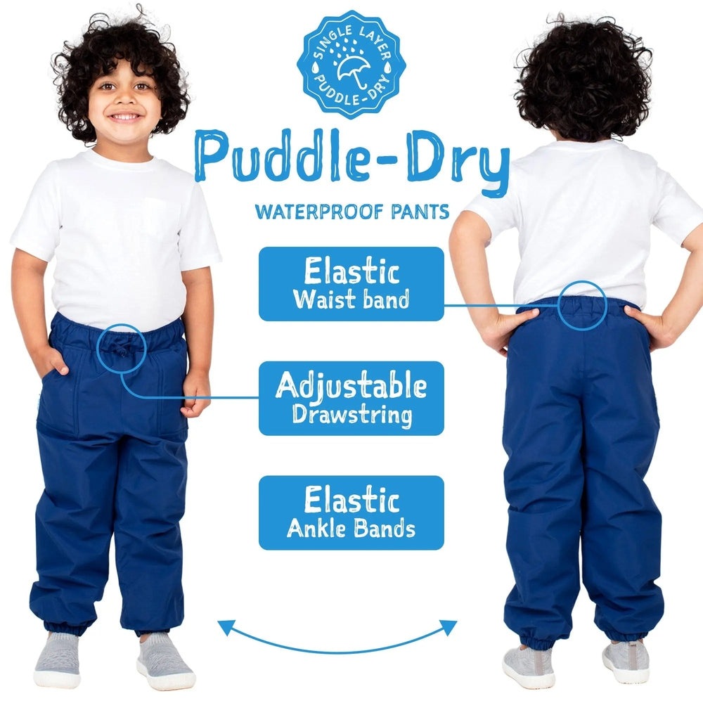 JAN & JUL Waterproof Puddle-Dry rain pants, blue with elastic waist, adjustable drawstring, and elastic ankle bands, shown on a child.