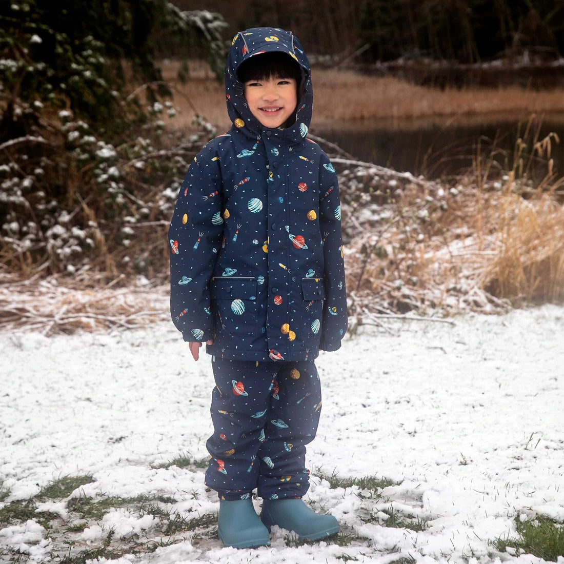 Jan & Jul Cozy-Dry Fleece Lined Rain Pants Planet Patrol — rain pants worn outdoors on a snowy day