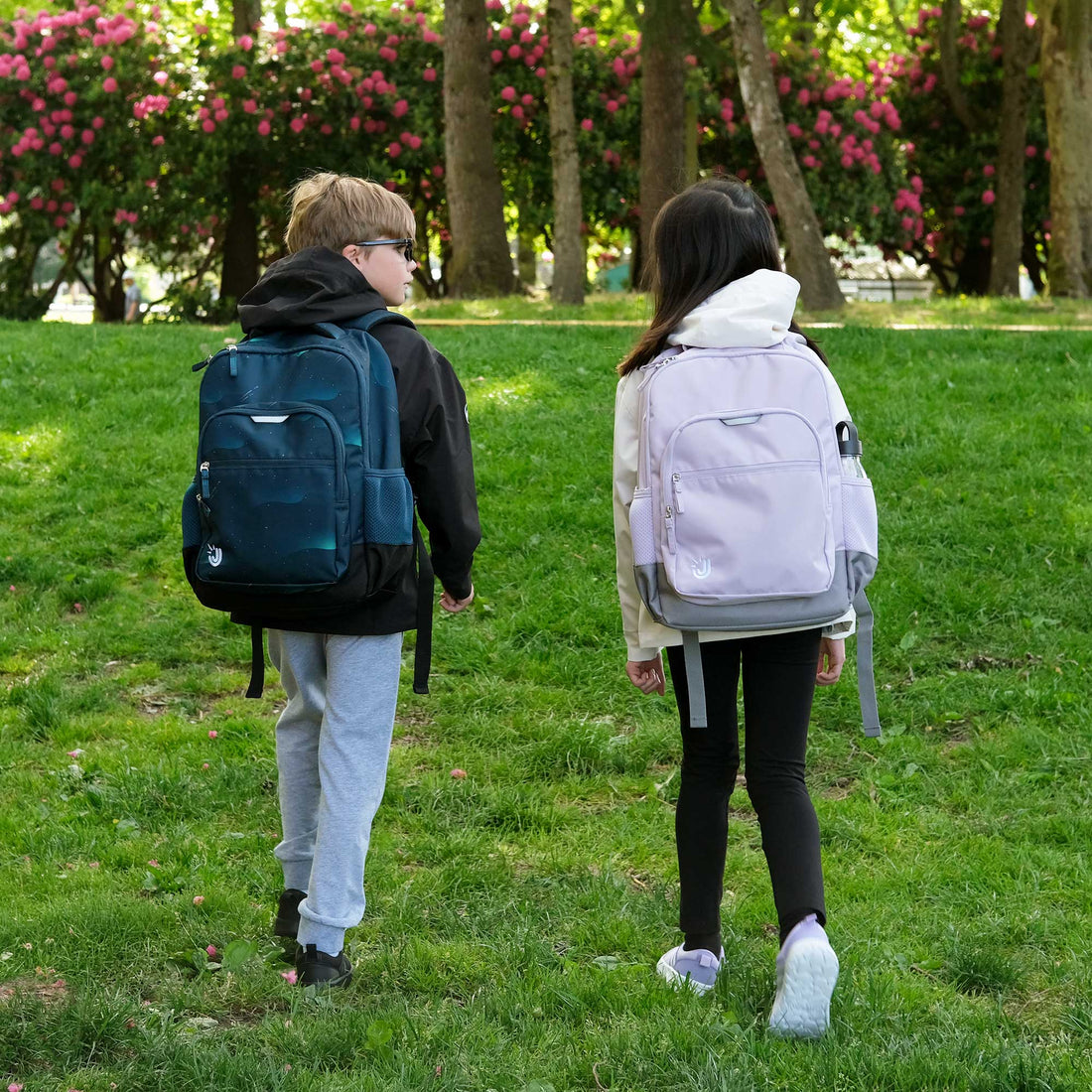 Kids walking outdoors with Jan & Jul youth backpacks