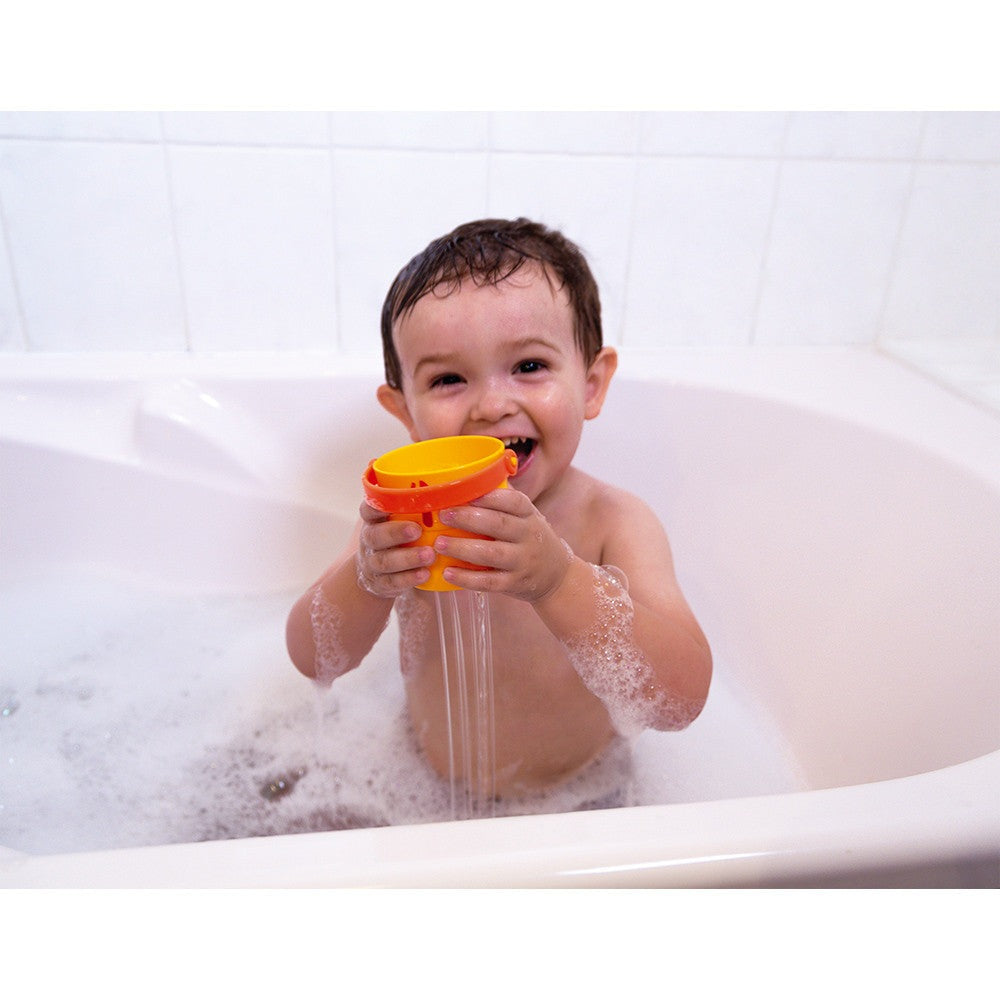 JANOD 5 Activity Buckets bath toy set with orange and yellow scoop held by smiling toddler