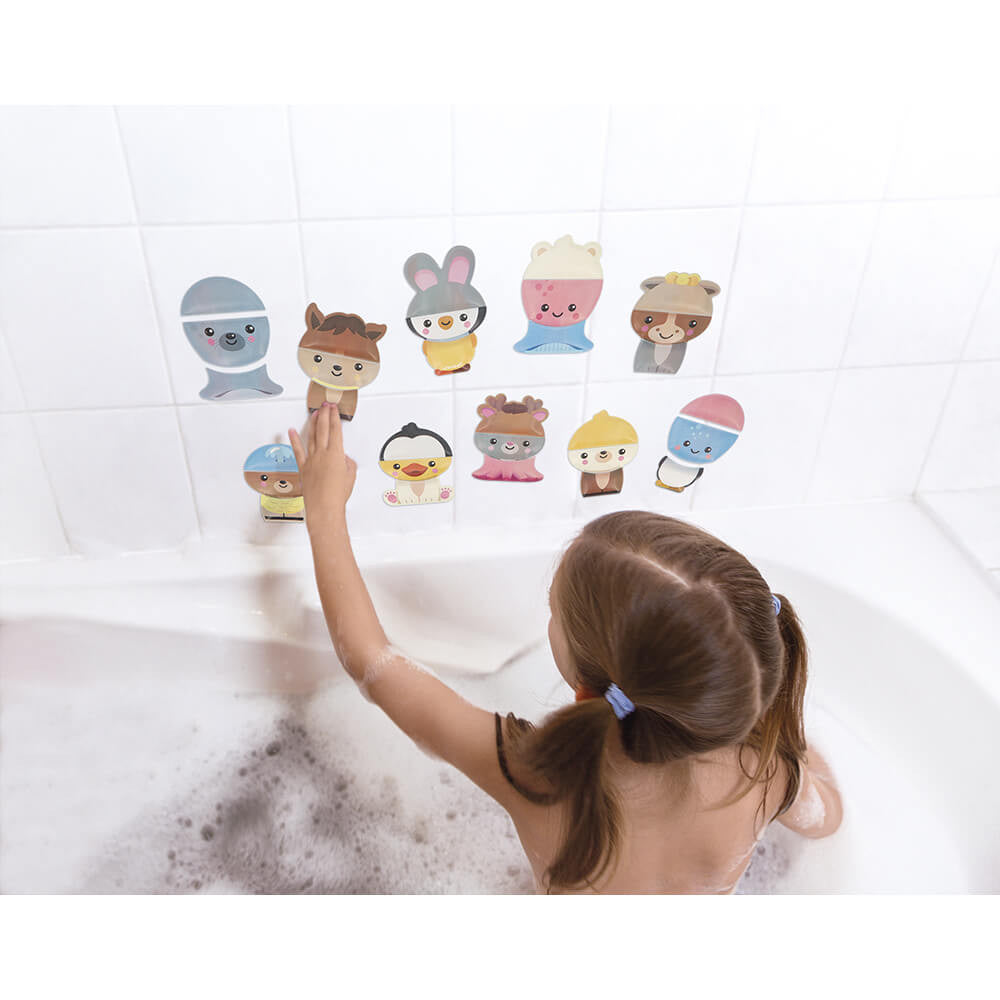 Janod Bath Mix and Match Animals set of colorful bath stickers on tiled wall beside a child in a bathtub