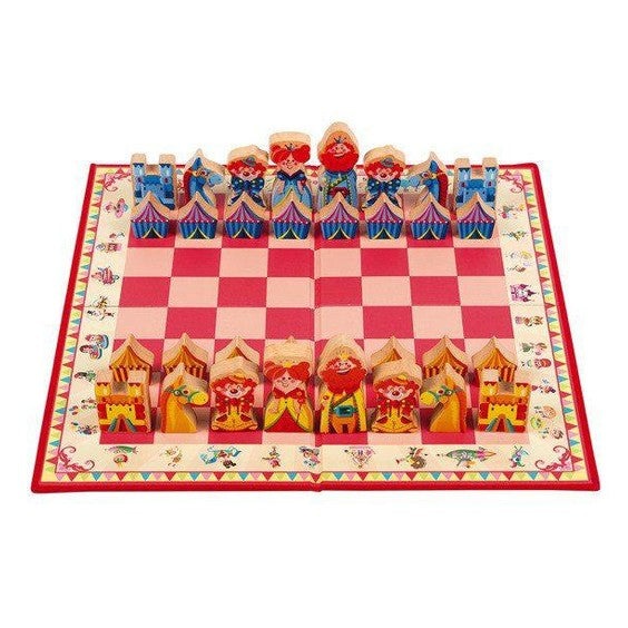 JANOD Carrousel Chess Game: 32-piece wooden circus chess set on red and pink checkerboard.