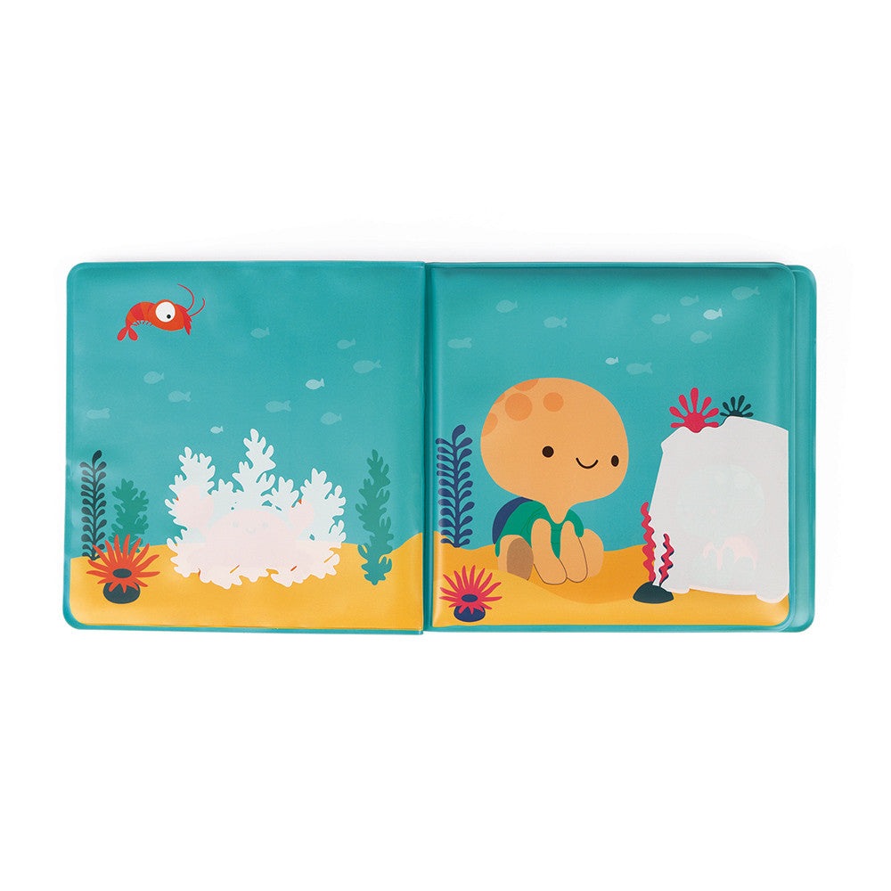 JANOD My Magic Bath Book open to turquoise underwater spread with orange sea creature and seaweed