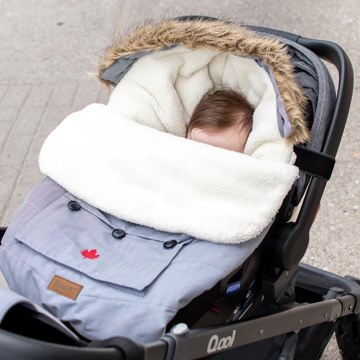 Juddlies infant car seat and stroller bag in salt-pepper grey with white faux fur lining