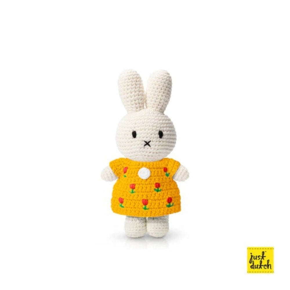 Just Dutch Miffy Tulip Dress Yellow crochet bunny plush standing in a bright yellow tulip-pattern dress.