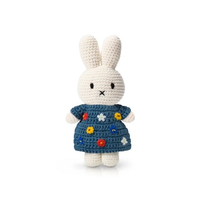 Just Dutch Miffy plush bunny wearing a blue floral dress, crocheted stuffed toy with colorful flowers