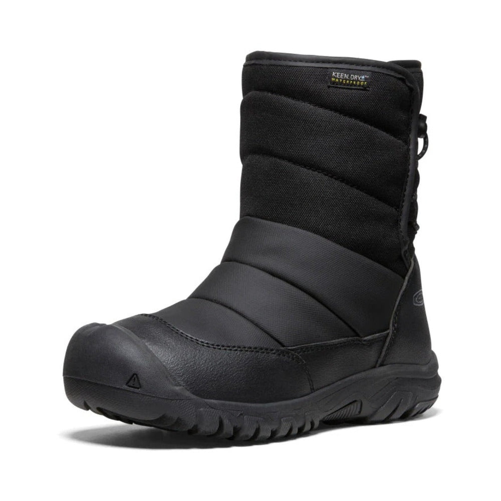 Keen Big Kids' Puffrider Waterproof Winter Boot Black, quilted upper and rugged outsole, shown standing ready for winter.