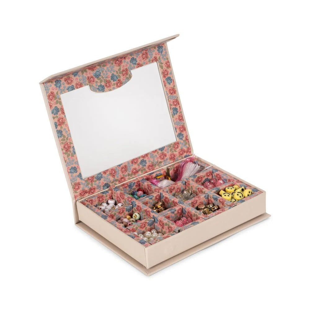 Konges Slojd Abc Jewellery Set in a floral-lined box with bead compartments and colorful accessories.