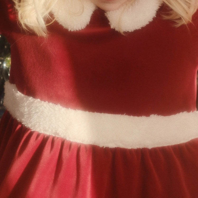 Konges Slojd Christmas Dress Red Dahlia, cozy red velvet toddler dress with white faux-fur trim at waist and collar.