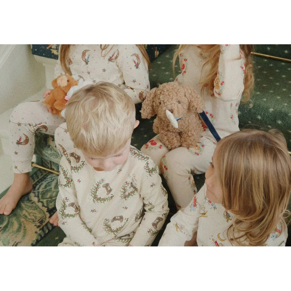 Konges Slojd Holiday Basic Blouse/Pants Set GOTS Luna worn by kids in cream PJs with whimsical prints.