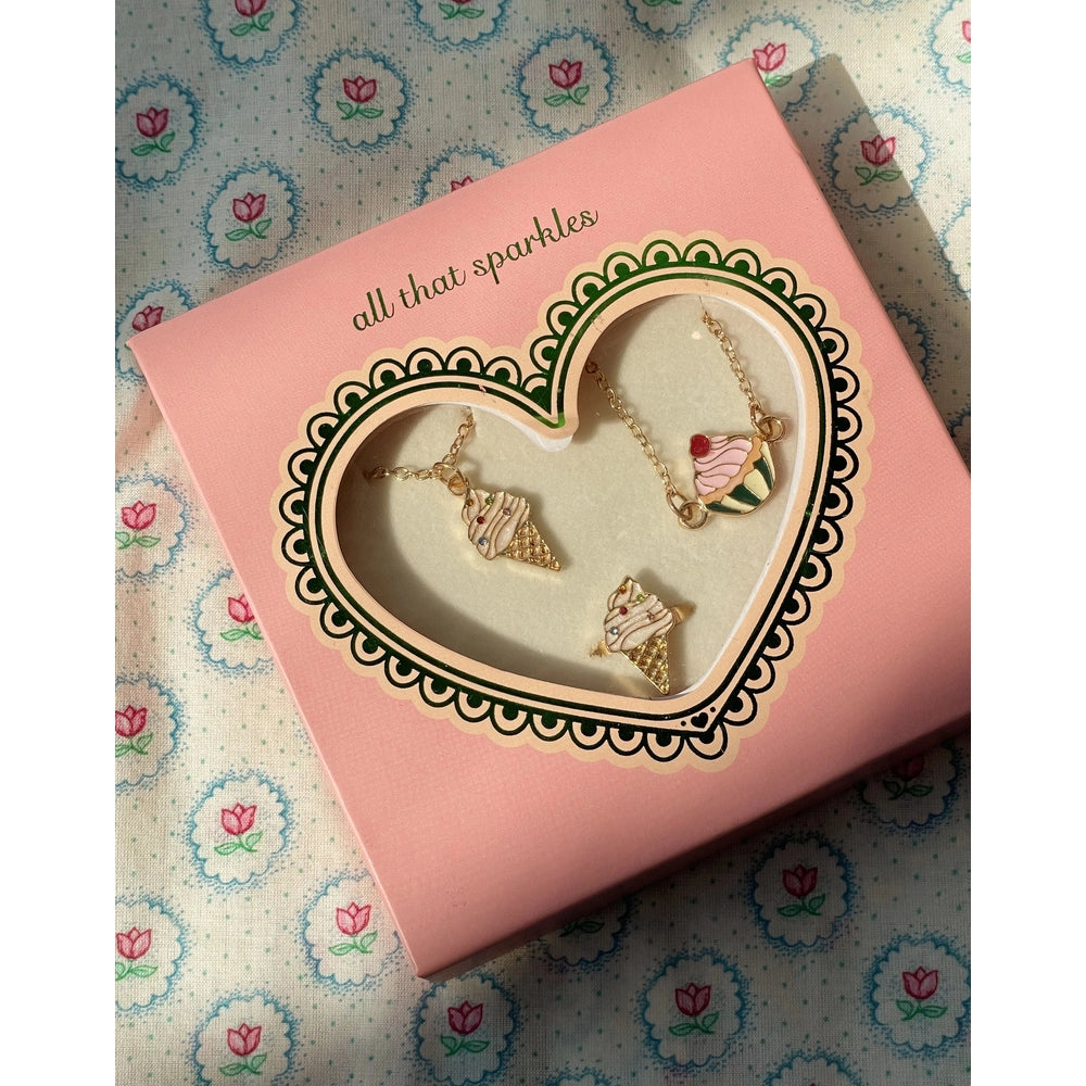 Konges Slojd Jewelry Set 2026 in Pink box with heart-shaped window, gold-tone ice cream cone and cupcake charms
