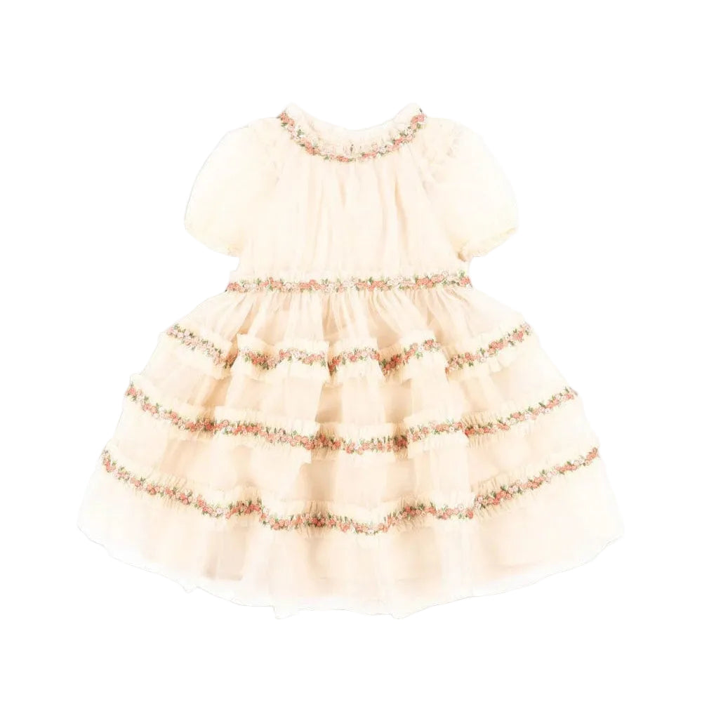 Konges Slojd Joelle Dress in Buttercream with floral trim and tiered layers.