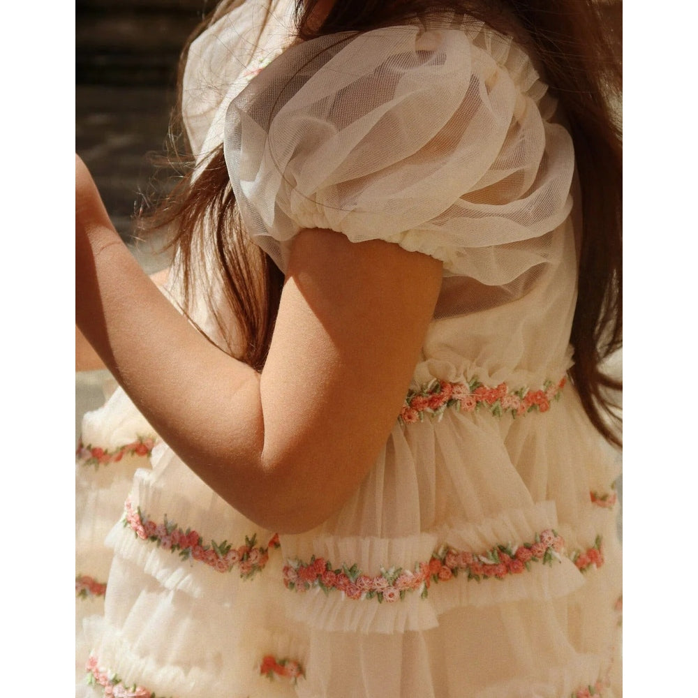 Konges Slojd Joelle Dress in Buttercream with pink floral embroidery and sheer tulle puff sleeves