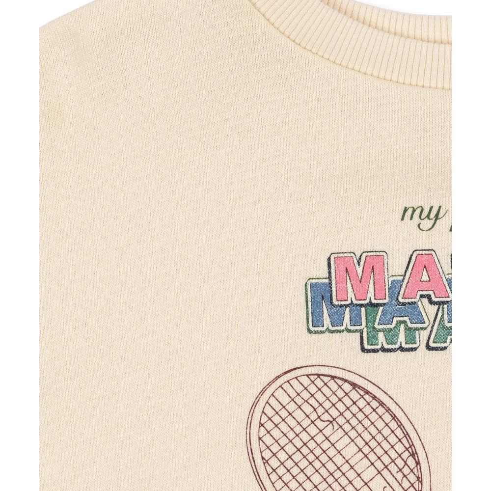 Konges Slojd Loupy Lou Sweatshirt in Buttercream with multicolor block-letter graphic and tennis racket illustration.