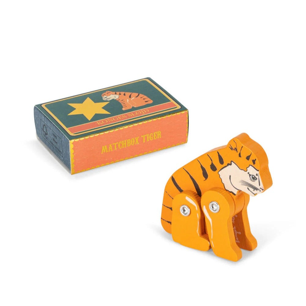 Konges Slojd Matchbox Animals tiger toy in bright orange with jointed legs, displayed beside its illustrated matchbox box.