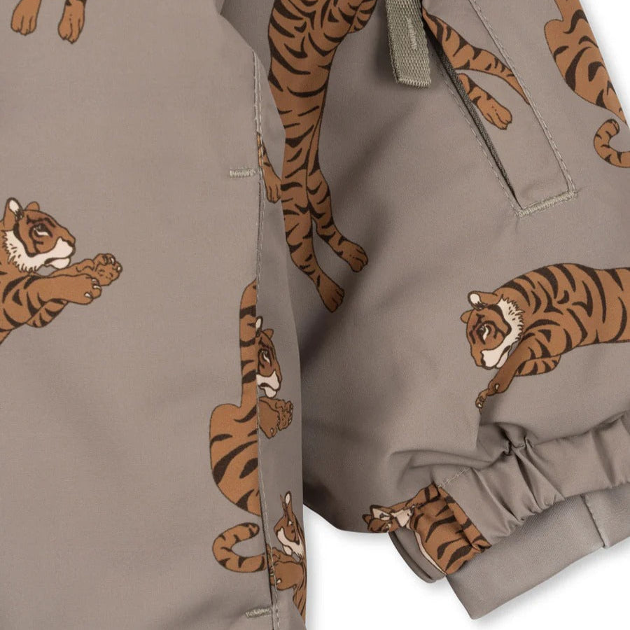 Konges Slojd Mismou Jacket Tiger Oak; taupe baby coat with tiger prints, elastic cuffs securing a snug sleeve.