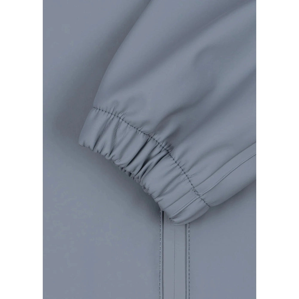 Konges Slojd Sharka Rain Set in Tradewinds blue-gray, close-up of sleeve with elastic cuff.