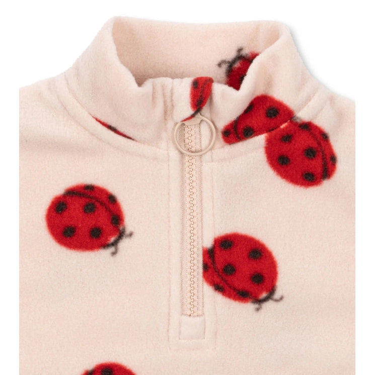 Konges Slojd Tavi fleece sweatshirt, pale pink with red ladybugs and zip collar