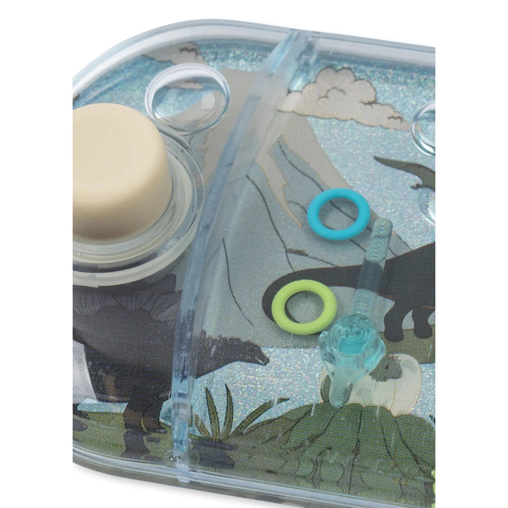 Konges Slojd Water Ring Toss Game in clear plastic with turquoise and lime rings, mountain-print background.