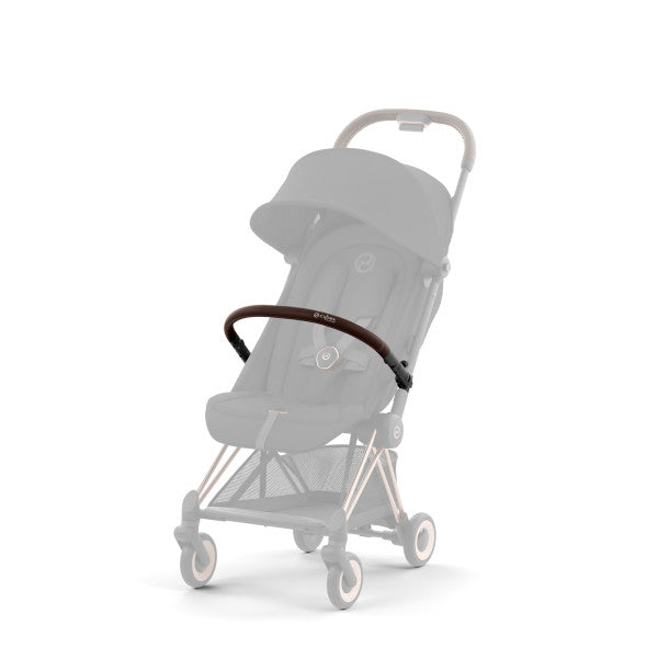 Lifestyle image of the Cybex Coya Stroller Bumper Bar in brown leather spans the stroller front, securely attached to the frame.