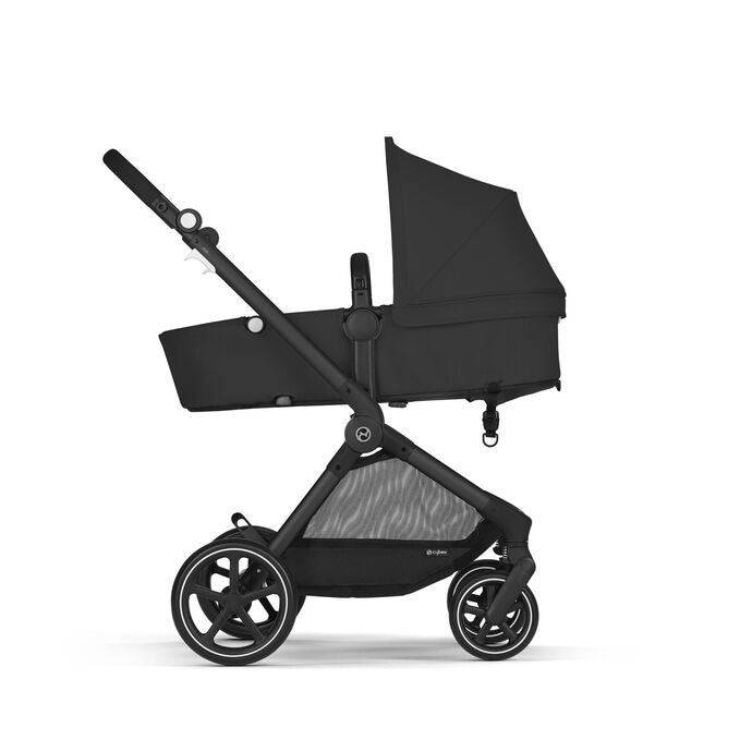 Lifestyle image of the Cybex EOS 2-in-1 Stroller Black Frame with aton 2 infant car seat in moon black, black frame.