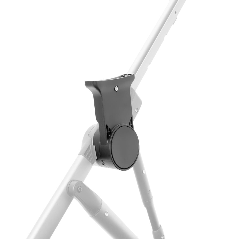 Lifestyle image of the Cybex Gazelle S Infant Car Seat Adapters For Britax mounted on white stroller frame.