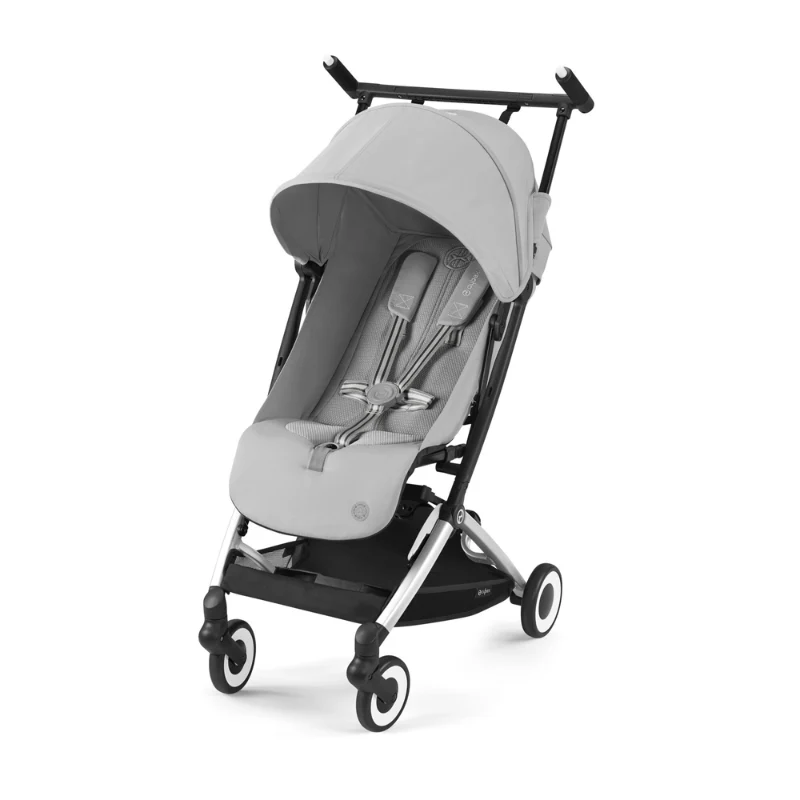 Lifestyle image of the Cybex Libelle 2 Stroller in light gray with canopy and padded seat, black frame.