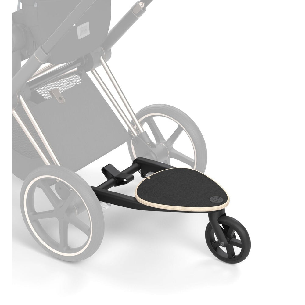 Lifestyle image of the Cybex Platinum Accessories Kid Board in black with a wood edge, attaches to a cybex stroller frame.