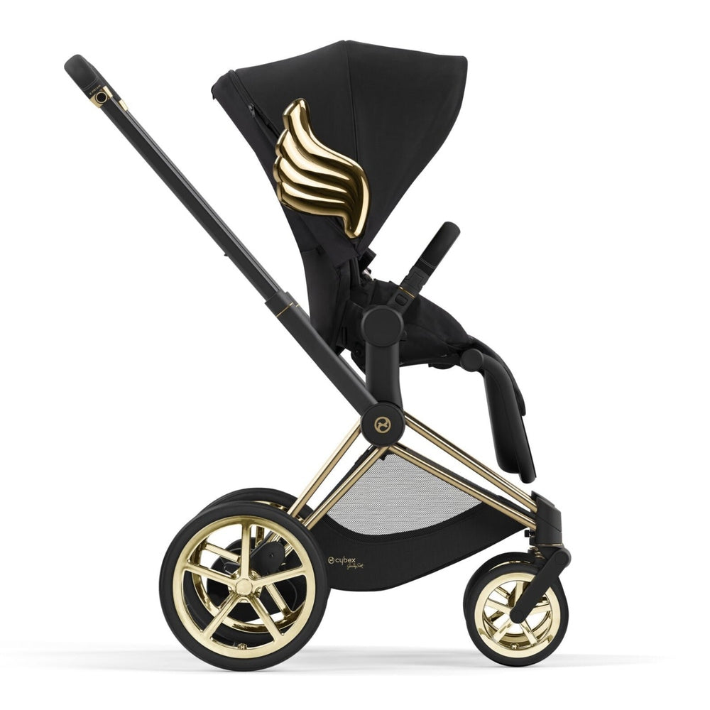 Lifestyle image of the Cybex Platinum e-Priam Stroller Jeremy Scott Wings in black with gold wing accents.