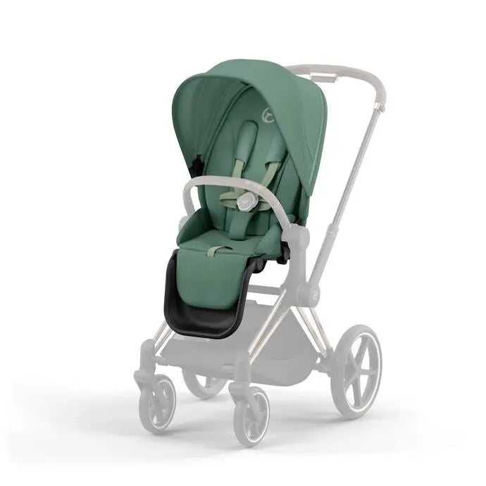 Lifestyle image of the Cybex Priam4/Ep Seat Pack stroller in green with sun canopy extended and white frame.