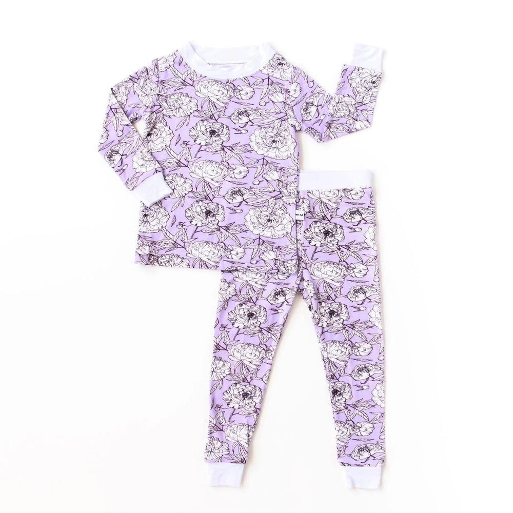 Little Sleepies Bamboo Pajama Set Peonies in lavender floral print with white cuffs, laid flat to show top and pants.