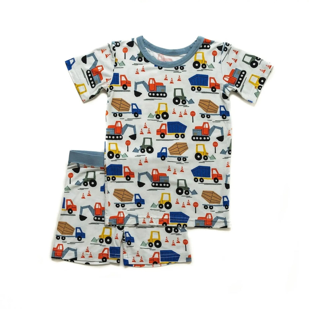 LITTLESLEEPIES Construction two-piece bamboo viscose pajama set for kids; short-sleeve top and shorts with colorful trucks.