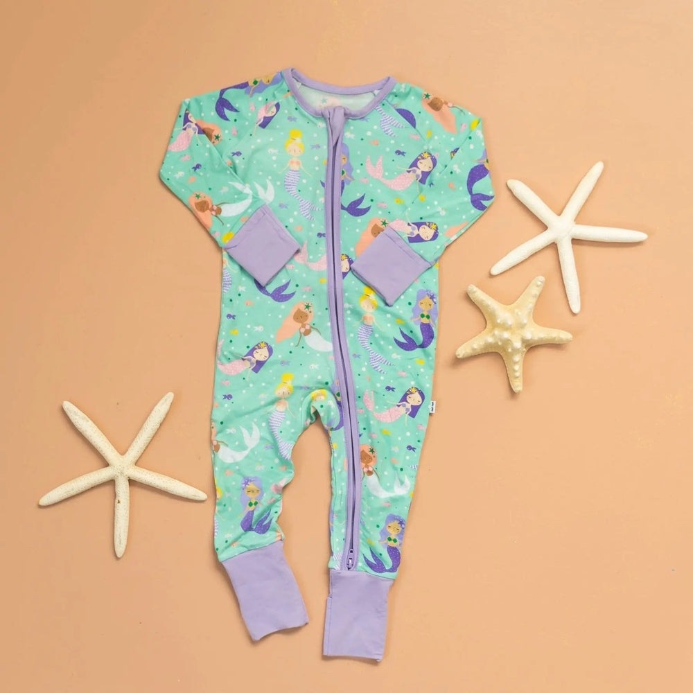 Littlesleepies Mermaid Magic Bamboo Viscose Zippy baby onesie in turquoise with purple cuffs, front zipper fastened.