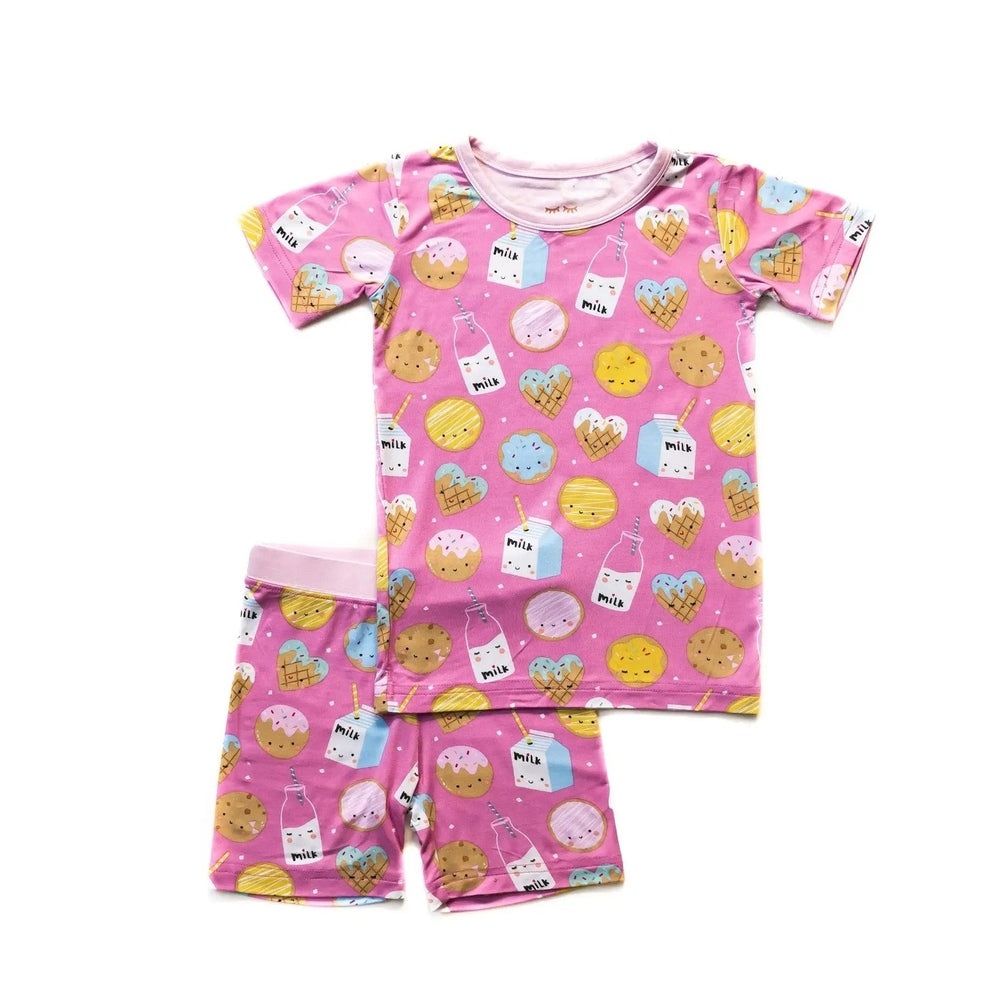 LITTLESLEEPIES Pink Cookies & Milk two-piece bamboo viscose pajama set, short-sleeve top and matching shorts laid flat.