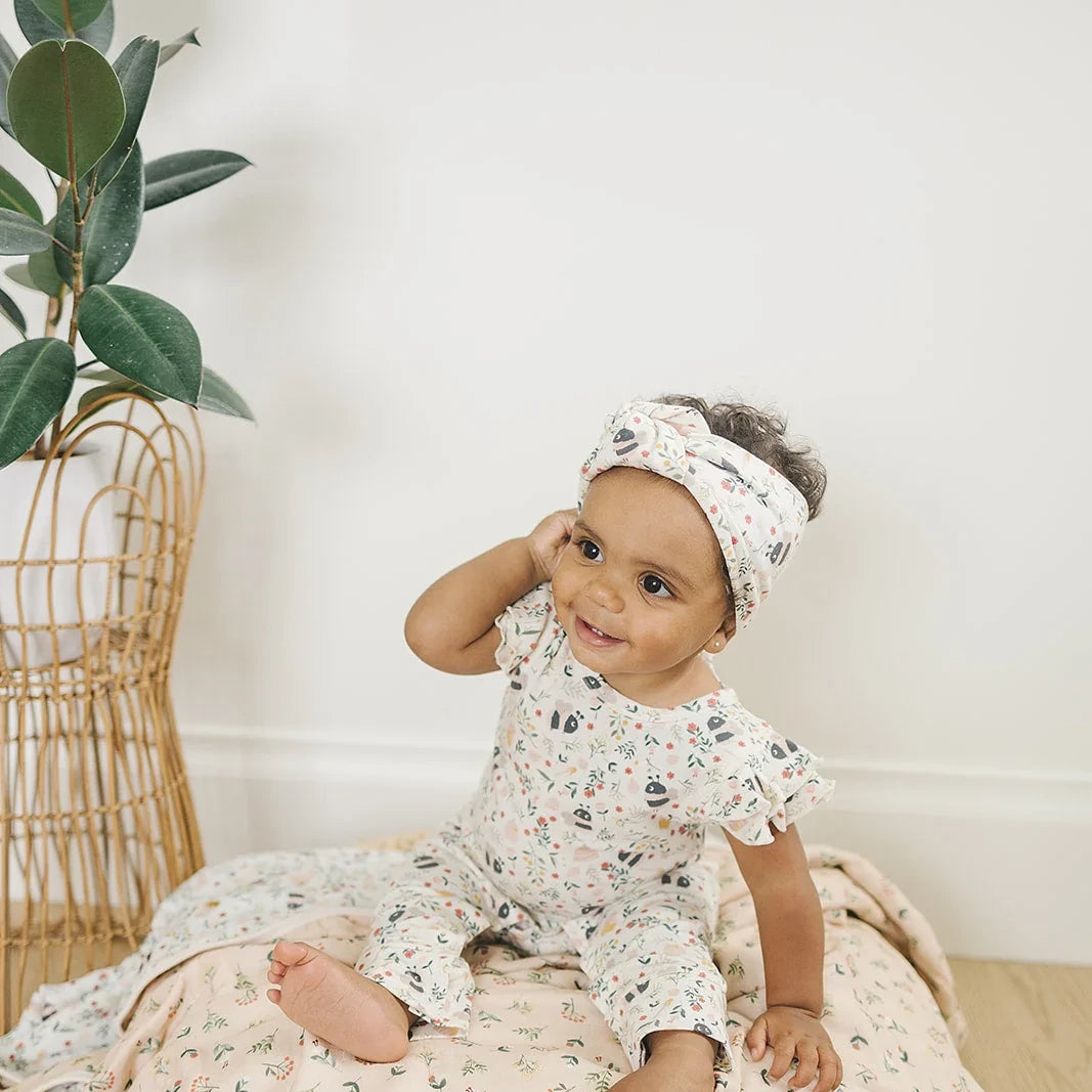 Loulou Lollipop Baby Muslin Quilt in Tanboocel® Bamboo Viscose - Bumble Bees — quilt blanket shown in a nursery setting.